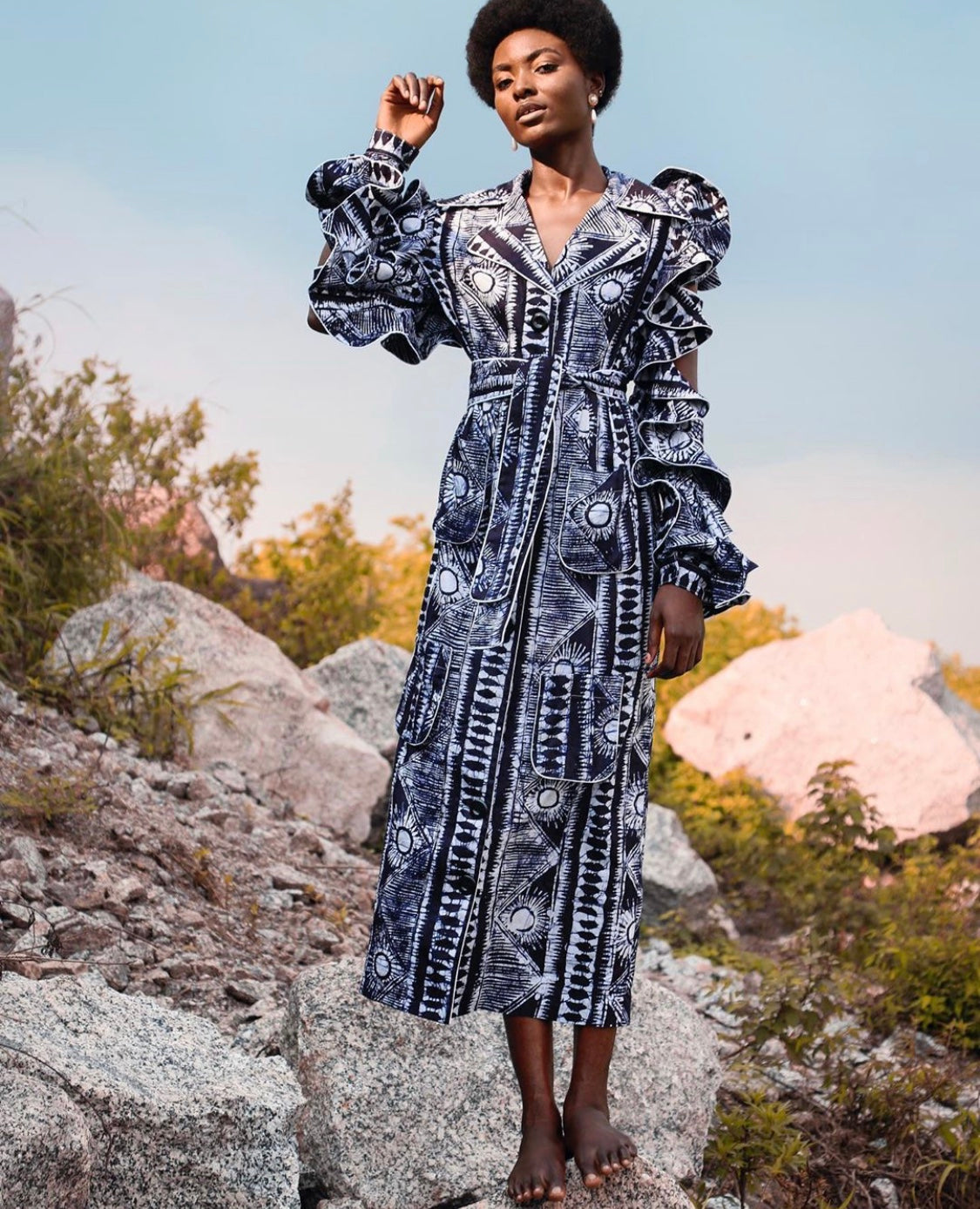 The iconic Ada midi shirt dress is a blend of different hand drawn mosaic patterns on a cotton fabric, reflecting the brand’s passion for culture and story telling . The beautiful piece features long sleeves with delicate straps and frills, a contrasting white piping on the neckline and military patch pocket at the front. This dress can be worn belted or unbelted and can also be styled as an over-dress.