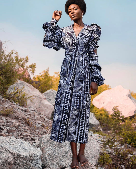 The iconic Ada midi shirt dress is a blend of different hand drawn mosaic patterns on a cotton fabric, reflecting the brand’s passion for culture and story telling . The beautiful piece features long sleeves with delicate straps and frills, a contrasting white piping on the neckline and military patch pocket at the front. This dress can be worn belted or unbelted and can also be styled as an over-dress.
