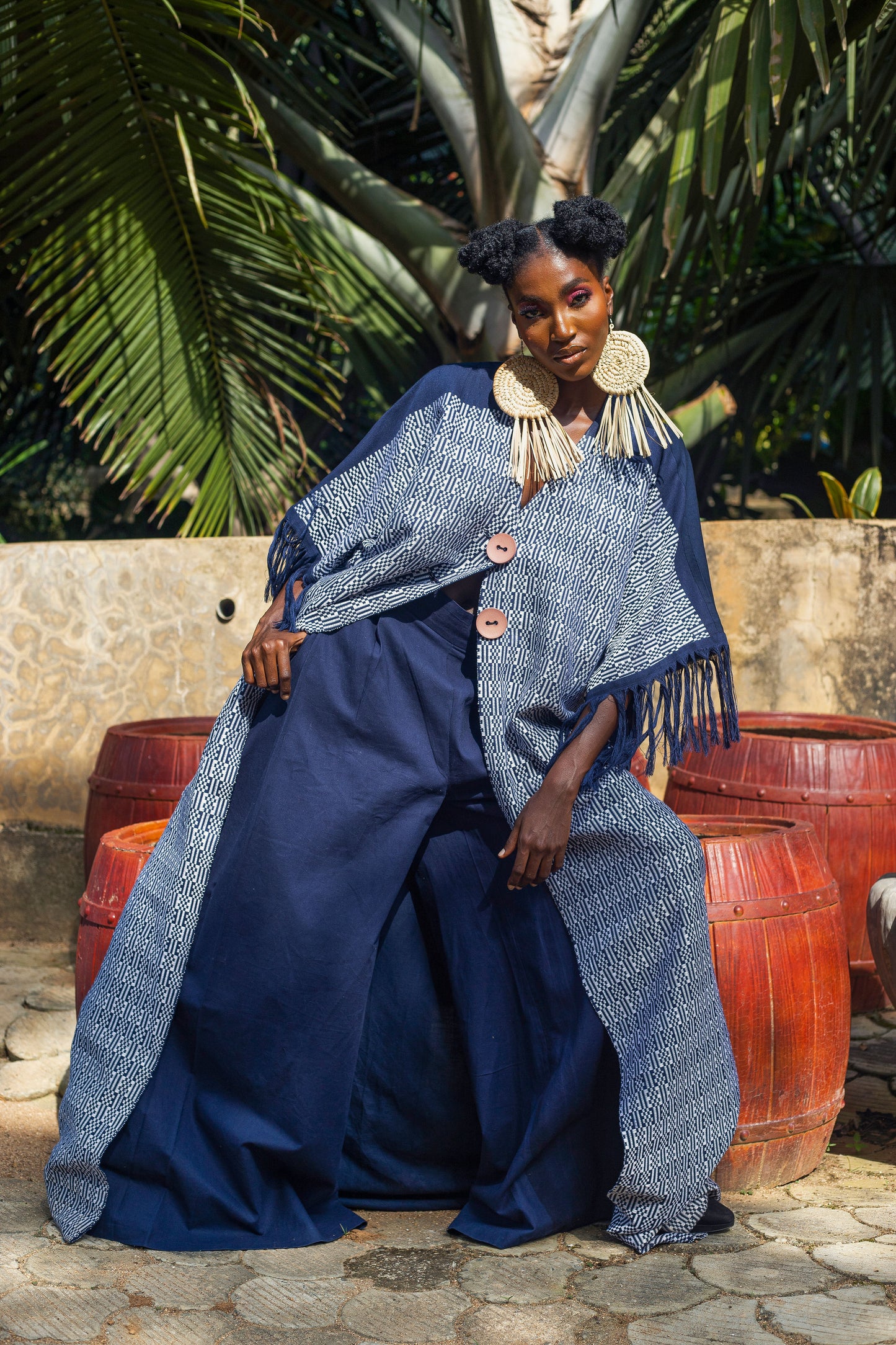 This outfit is a matching set of  Kimono and pants made wit a blend of  woven cotton and linen. It offers a harmonious blend of comfort and  breath-ability.   This two piece is characterized by its relaxed exaggerated fit, making it perfect for a wide range of occasions, from casual outings to more sophisticated gatherings. The use of woven cotton and linen not only ensures durability and ease of wear but also adds a textural depth that enhances the aesthetic appeal of the set.