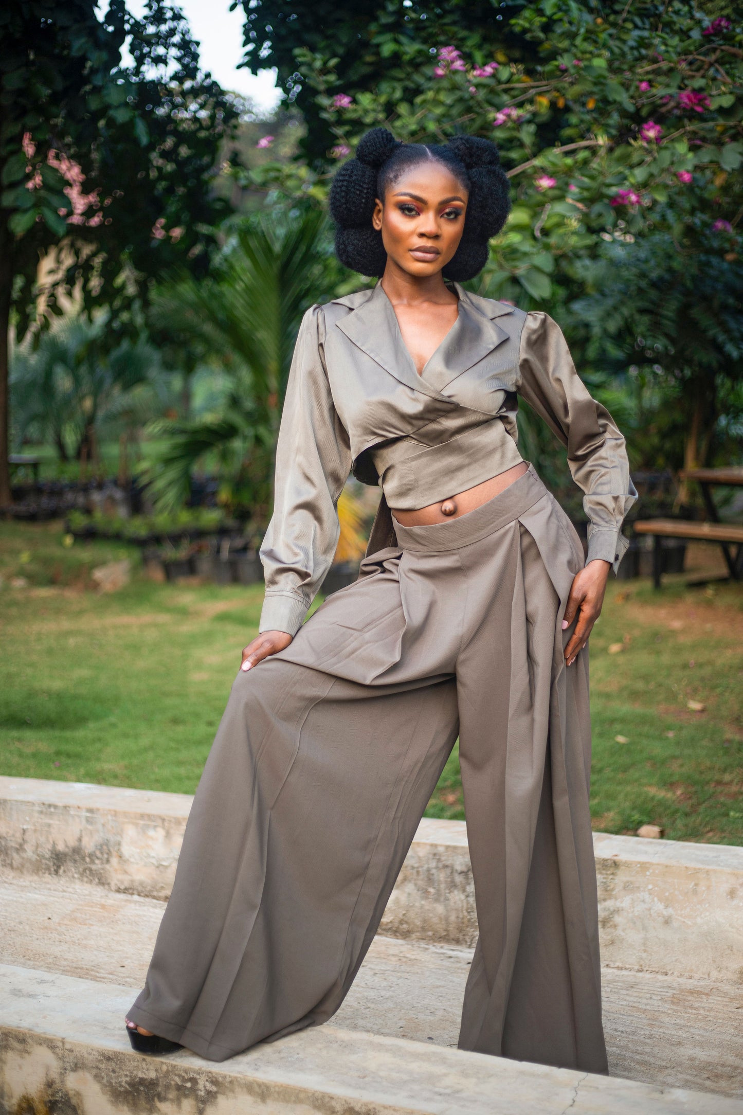 Elevate your wardrobe with our Strap Crop Two-Piece. Crafted from luxurious silk fabric, the wrap crop top features a sophisticated neck lapel and elegant long sleeves with a wrist cuff. The accompanying wide legged pant boasts a comfortable fit and convenient side pockets. Perfect for any occasion.